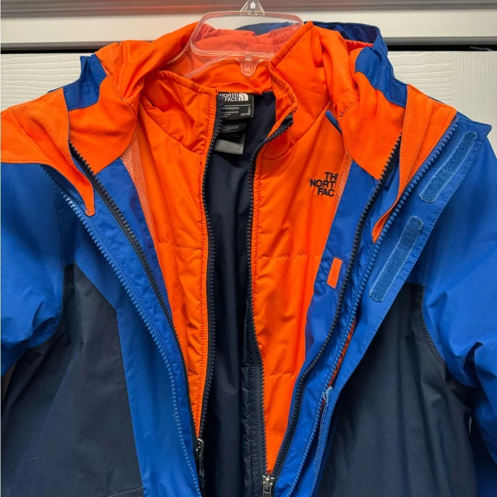 NORTH FACE Boy’s winter jacket. Boy’s size Large (14/16). Blue & Orange